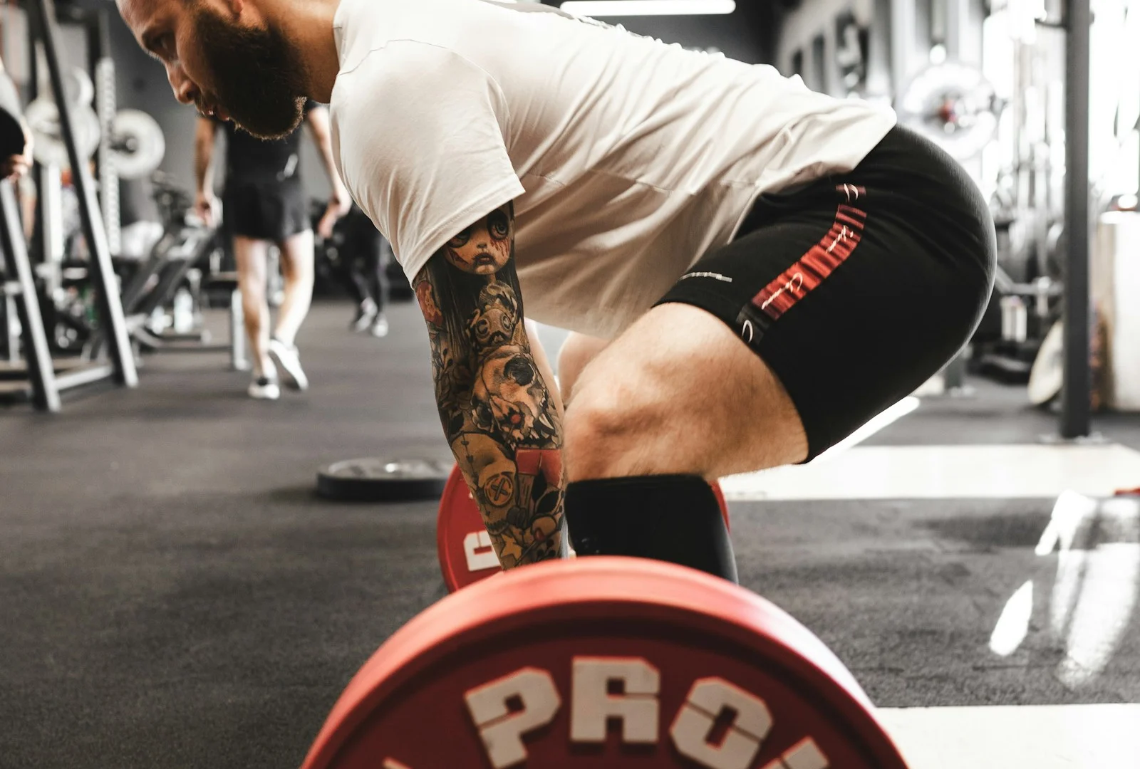 Leather lifting belts on a rack in a strength gym